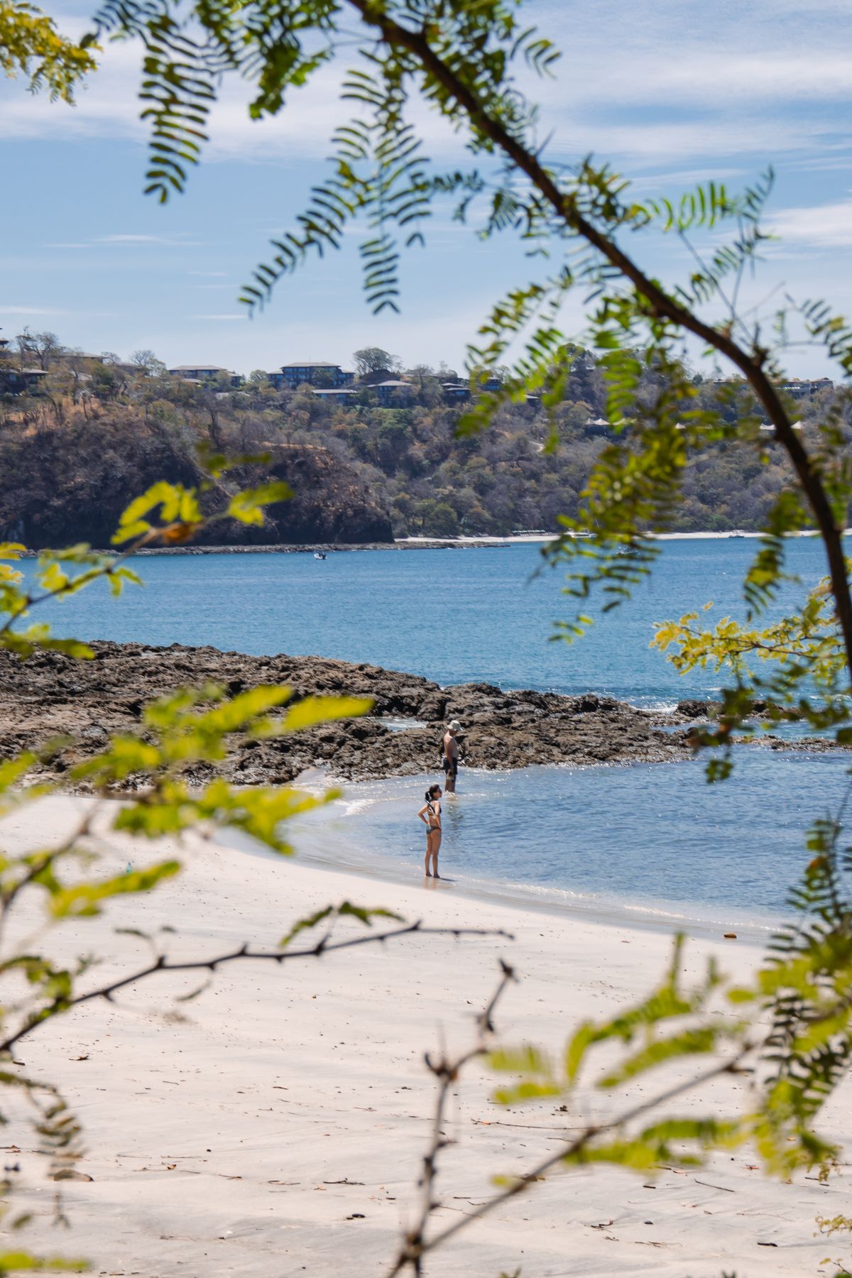People enjoying the beach and ocean in Costa Rica