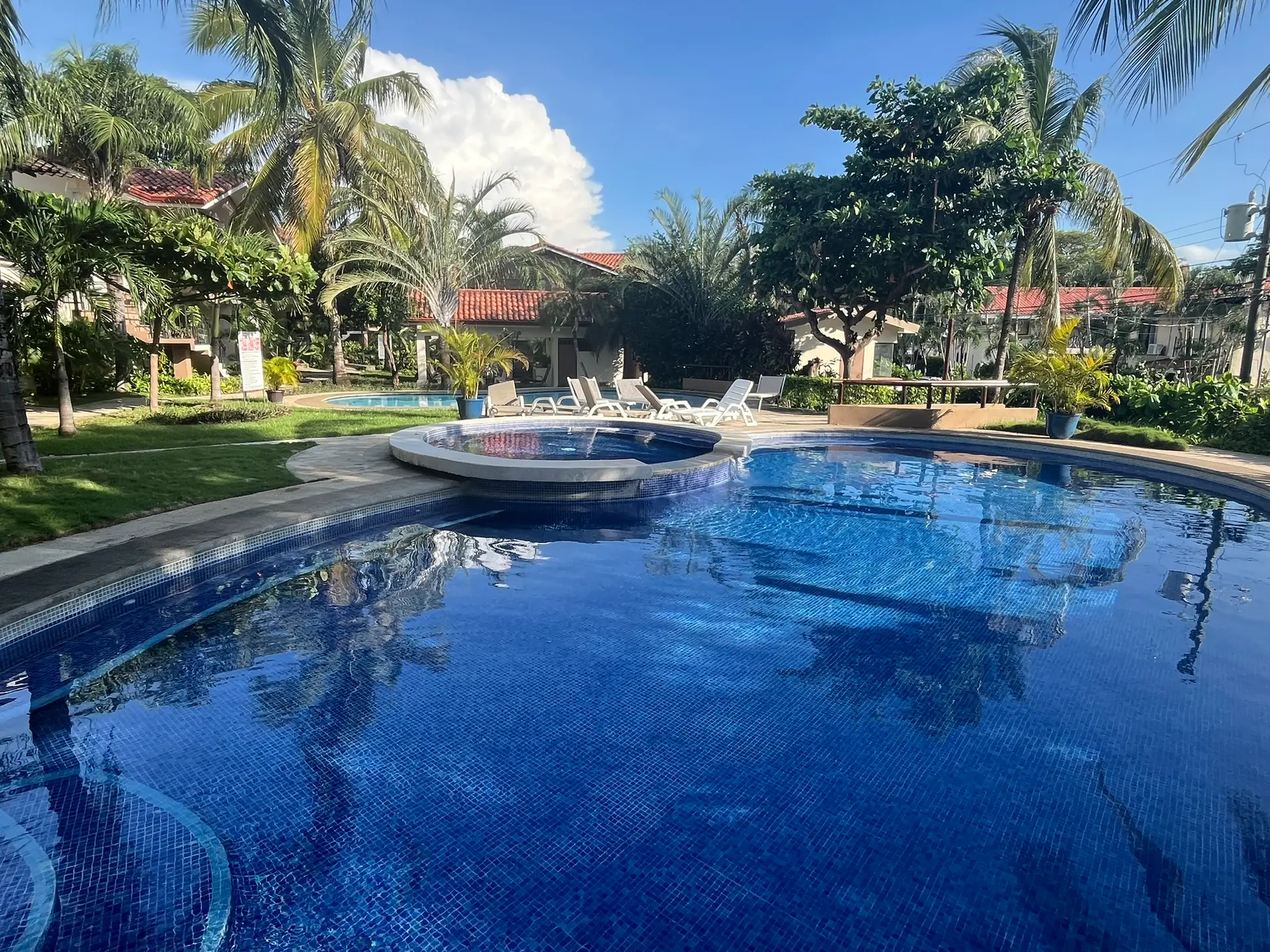 Community pool and tropical landscaping in Las Palmas