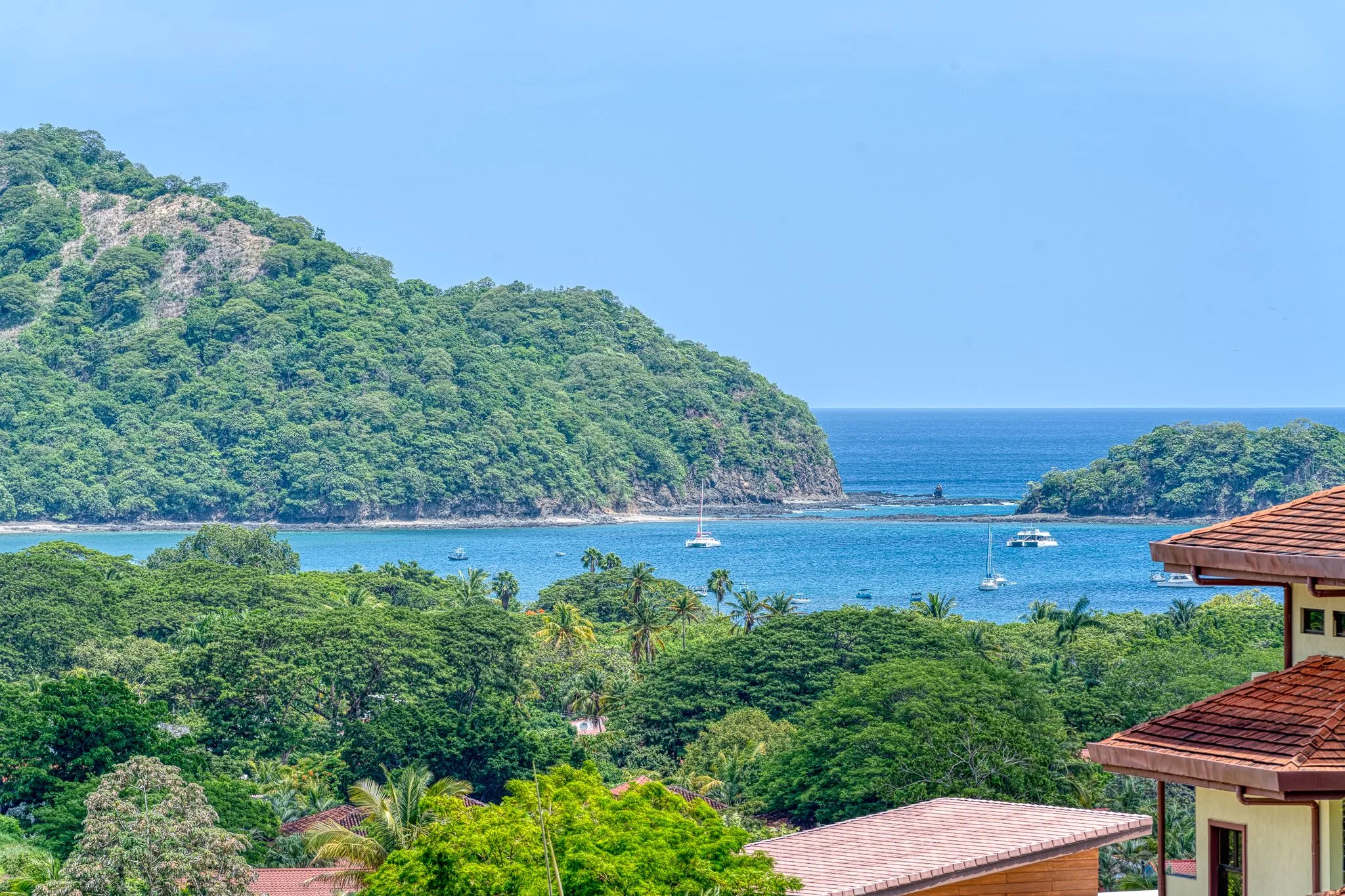 View across Playas del Coco bay from a hillside community