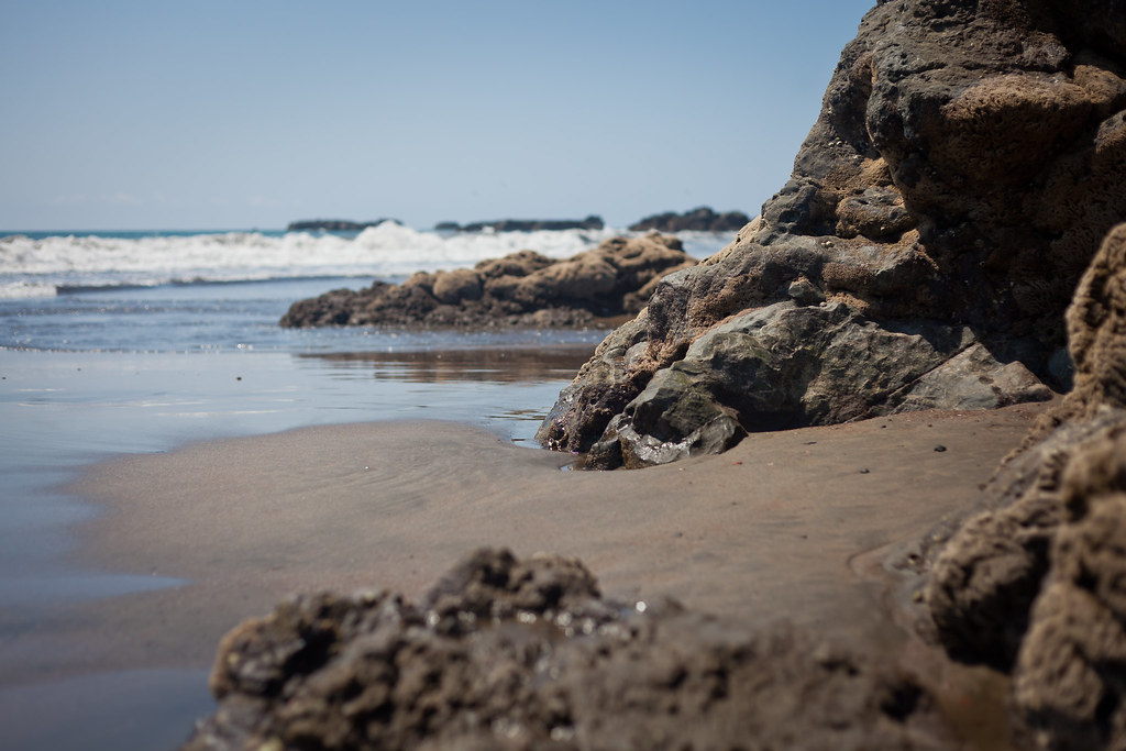 Costa Rica beach with rocks and ocean waves