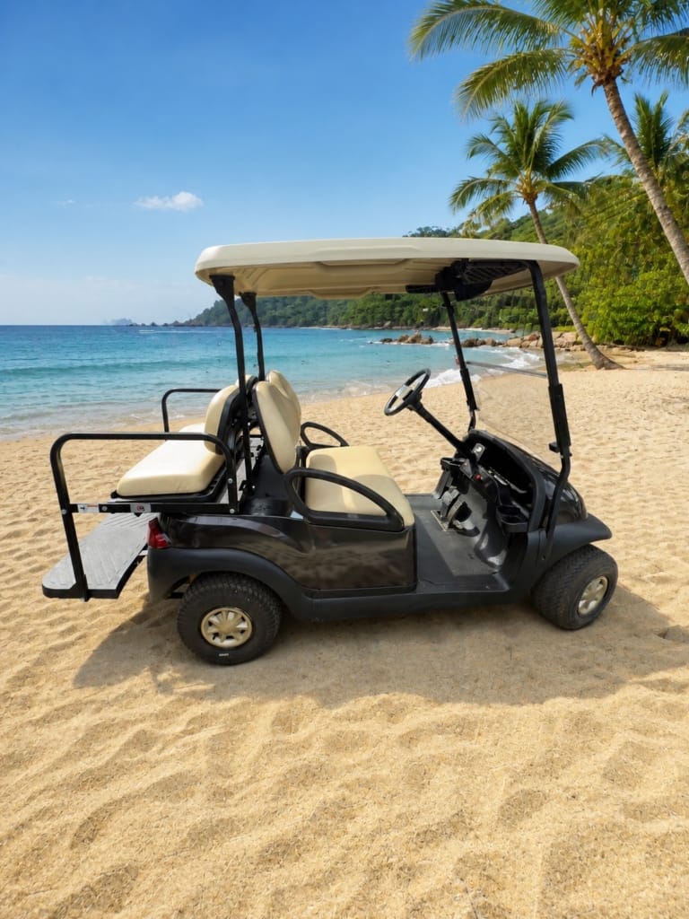 Black 4-seat lithium golf cart rental at the beach in Playas del Coco, Costa Rica