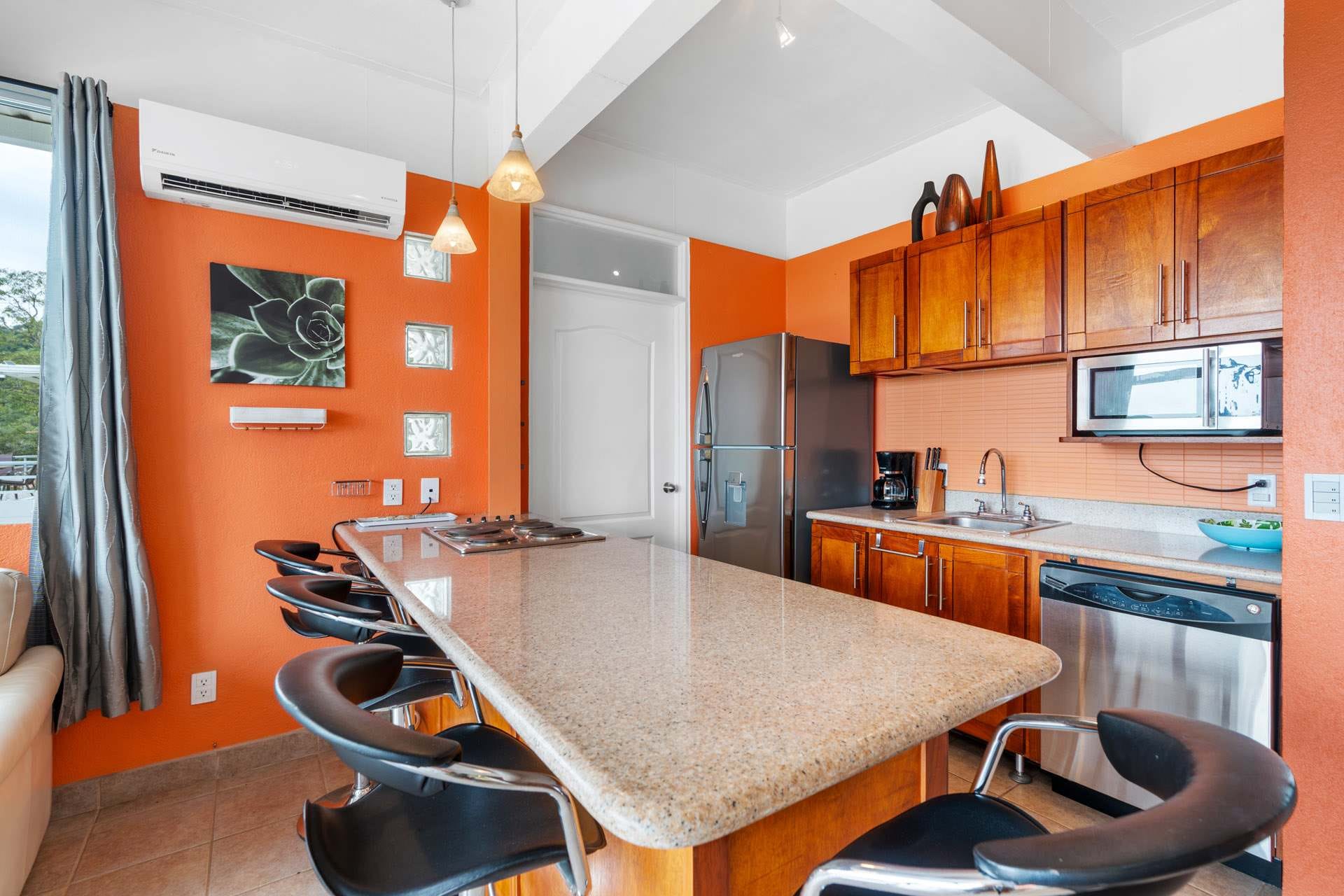 Kitchen breakfast bar at Tucanes 12 vacation rental in Playas del Coco