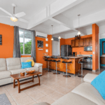 Open living area and kitchen at Tucanes 12 vacation rental in Playas del Coco