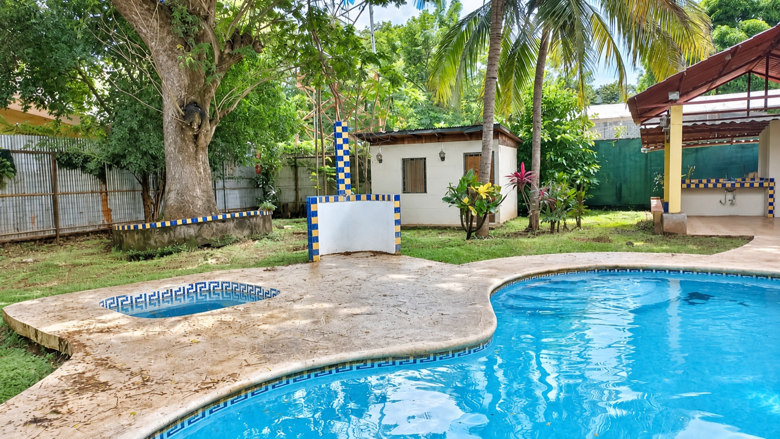 Pool, garden and storage building at La Segovia Pool Home